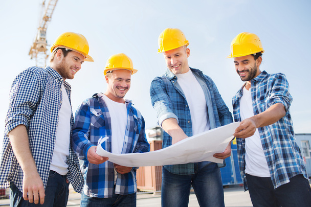 group of builders with tablet pc and blueprint - Fotó, kép