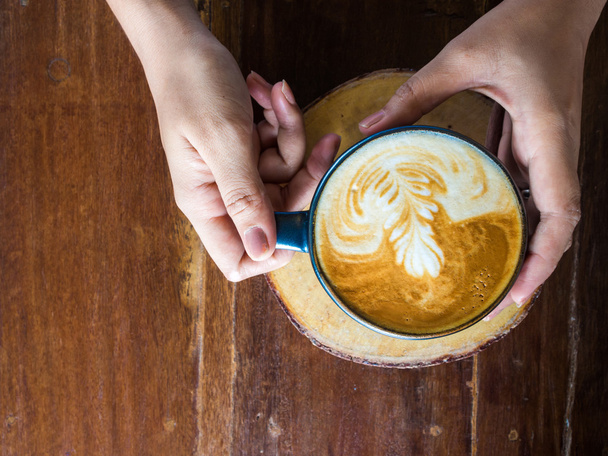 Woman hands holding mug of hot coffee drink - Photo, Image