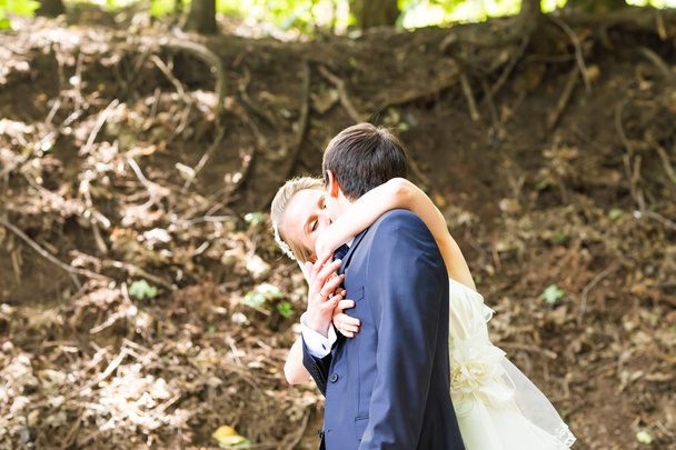 Wedding, Beautiful Romantic Bride and Groom Kissing - Фото, изображение
