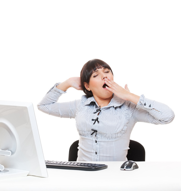 Estúdio tiro de mulher de negócios cansada bocejando em seu local de trabalho
 - Foto, Imagem
