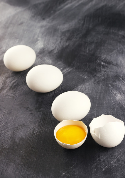 Raw eggs against a dark background - Zdjęcie, obraz