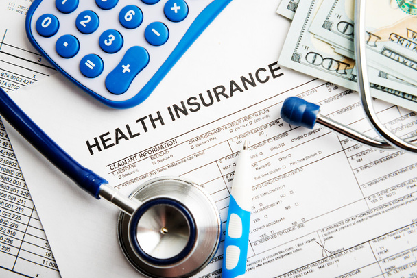 Health insurance application form with banknotes - Foto, imagen