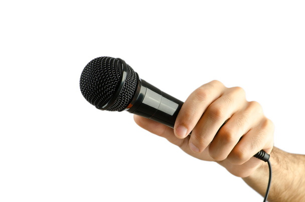 Hand holding microphone on white - Foto, Bild