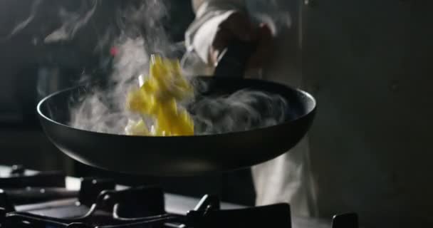 experienced Italian chef with the classic movements makes stir-fry one of its colorful and tasty dishes - Footage, Video