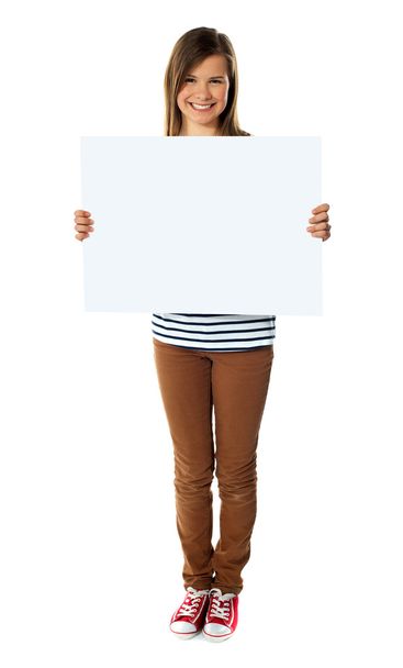 Smiling girl holding empty white board - Foto, Imagen
