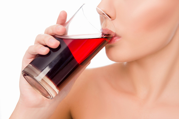 Close up photo of sensitive  woman drinking cherry juice  - Foto, afbeelding
