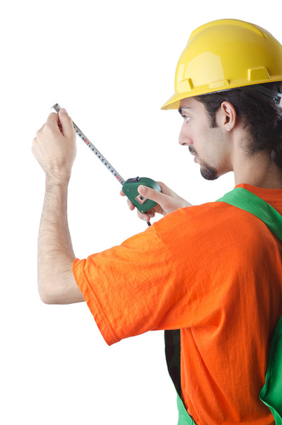 Worker with measuring tape on white - Foto, imagen