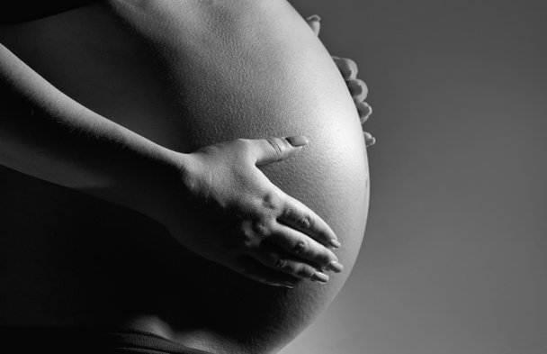 Studio egy terhes nő portréja - Fotó, kép