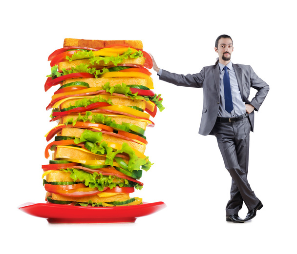 Man and giant sandwich on white - Foto, Imagem