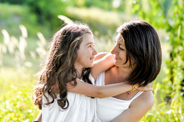 mother and daughter hugging - Photo, Image