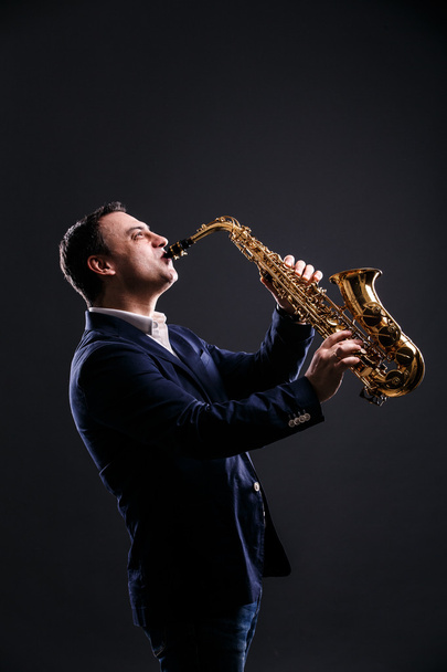 musician plays jazz at saxophone - Fotoğraf, Görsel