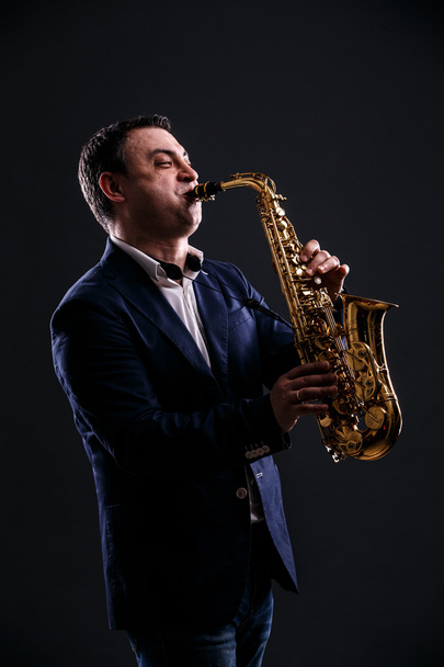 musician plays jazz at saxophone - Zdjęcie, obraz