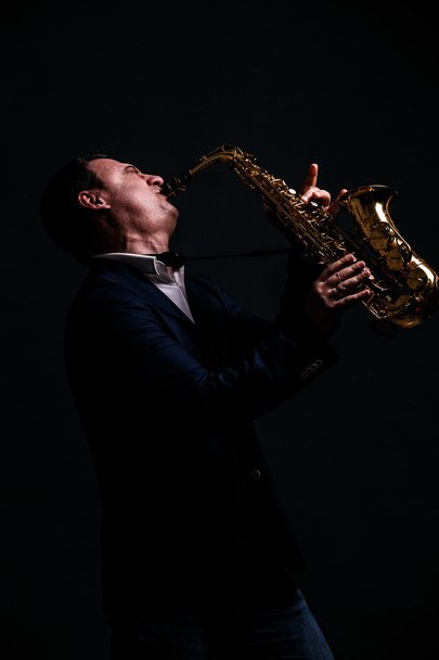 musician plays jazz at saxophone - Photo, image