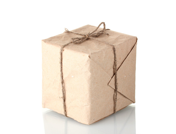 Small parcel wrapped in brown paper tied with twine isolated on white - Fotografie, Obrázek
