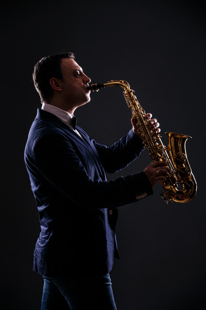 musician plays jazz at saxophone - Foto, imagen