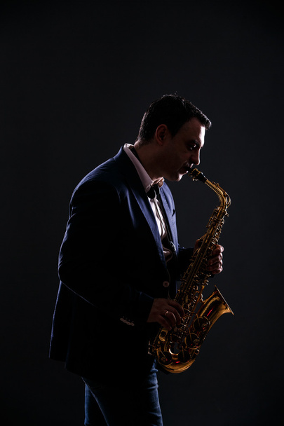 musician plays jazz at saxophone - Fotografie, Obrázek