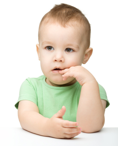Portrait of a cute and pensive little boy - Фото, изображение