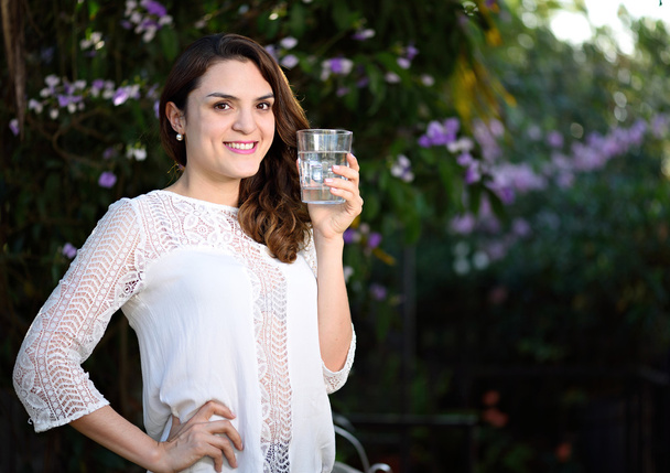 smiling girl with glass water - Photo, Image