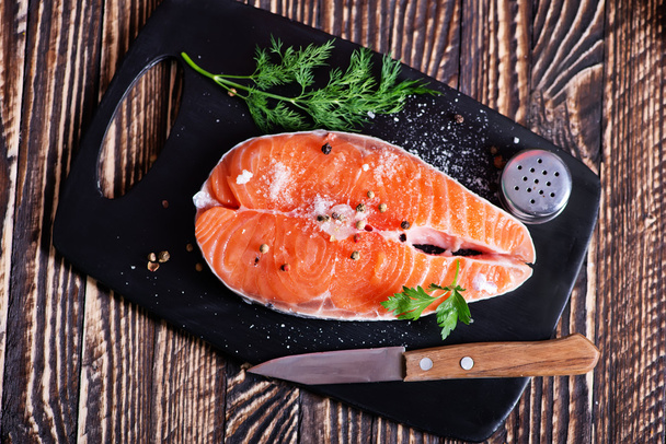 raw salmon on slate - Foto, Imagem