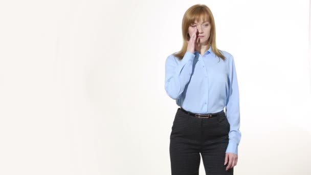 scratching his nose. lies gesture. girl in pants and blous.  Isolated on white background. body language. women gestures. nonverbal cues - Video