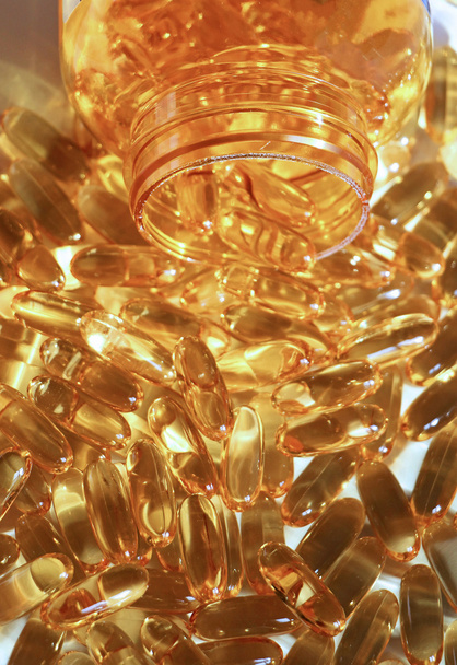 Yellow gel capsules - Foto, afbeelding