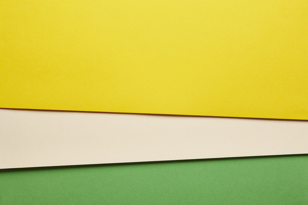 Colored cardboards background in yellow beige green tone. Copy s - Foto, Bild