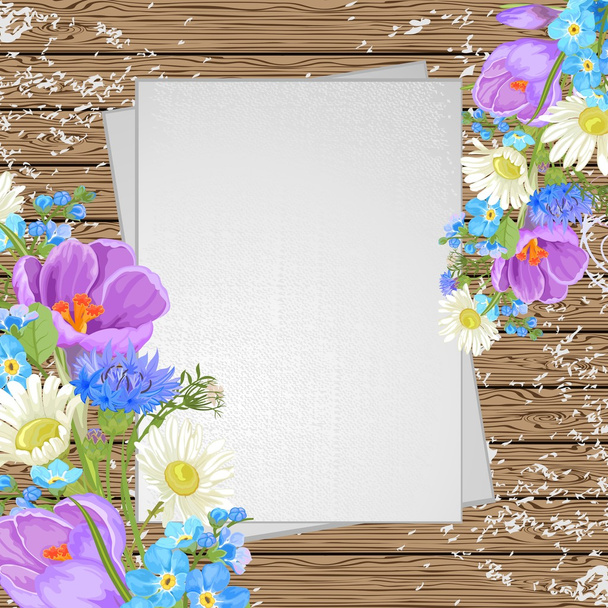 Spring flowers on a wooden background, top view - Vektori, kuva