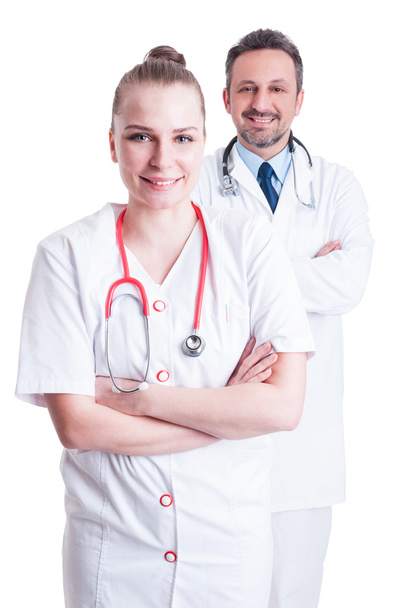 Przyjazny mężczyzna i kobieta lekarze z Stetoskopy i biały COA - Zdjęcie, obraz