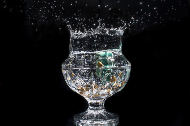 Splash in a crystal glass - Photo, Image