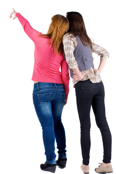 Вид ззаду на двох молодих жінок
 - Фото, зображення