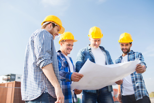 group of builders with tablet pc and blueprint - Foto, Imagem