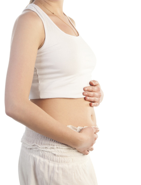 Donna incinta che tocca il ventre con le mani - Foto, immagini