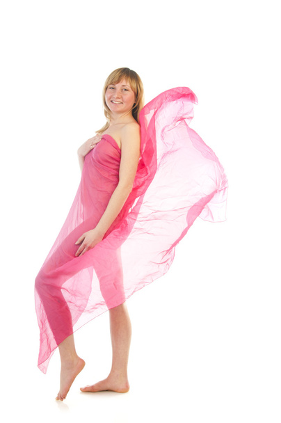 Beautiful pregnant young woman in pink blowing dress - Fotó, kép