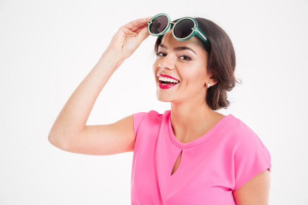Happy attractive young woman with sunglasses smiling  - Foto, Bild