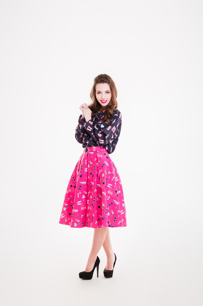 Charming happy young woman in bright pink skirt - Photo, image
