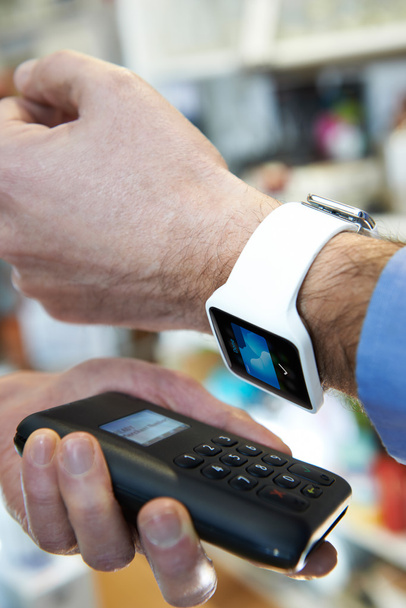 Man Using Contactless Payment App On Smart Watch In Store - Zdjęcie, obraz