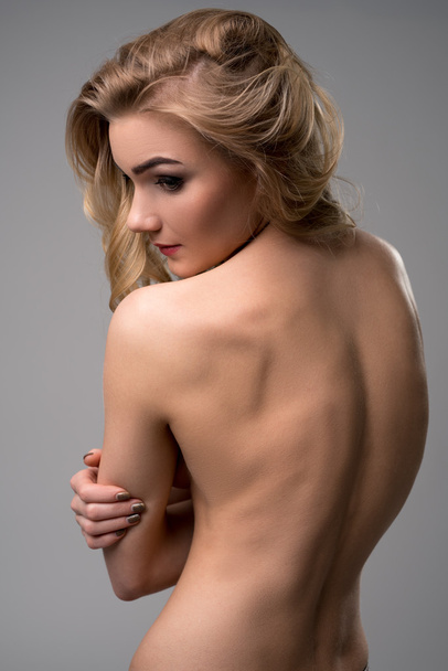 Image of lovely nude blonde posing back to camera - 写真・画像