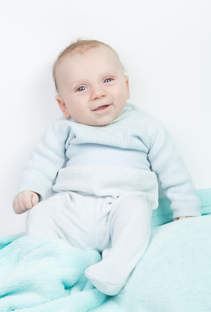 Criança feliz com olhos azuis e romper turquesa
 - Foto, Imagem
