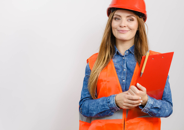 Woman engineer construction builder in helmet. - Zdjęcie, obraz