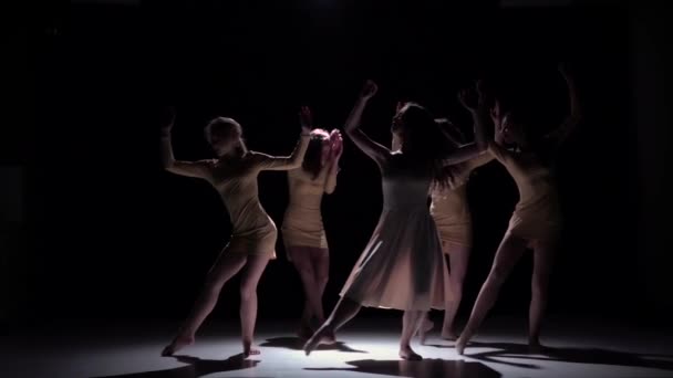 Graceful contemporary dance of five dancers in white clothes on black, shadow, slow motion - Video