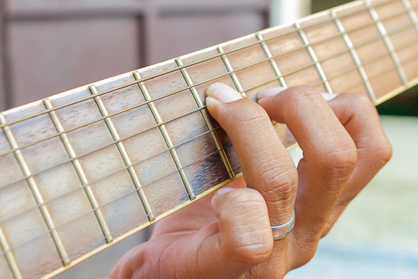 Guitarist hand playing acoustic guitar - Photo, Image