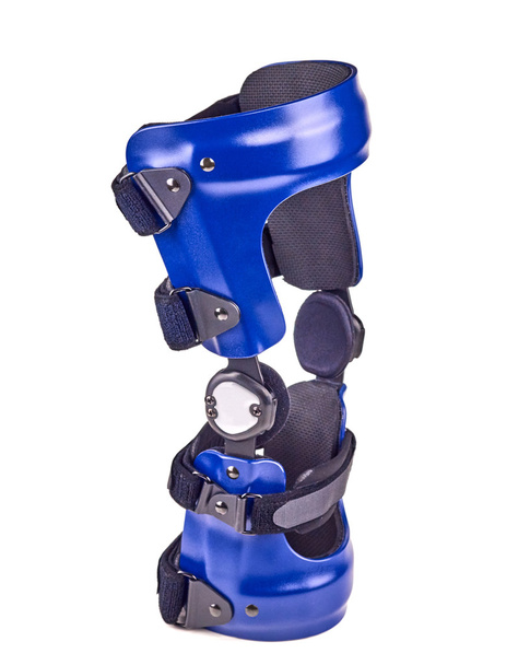 Blauwe opgetuigd knie brace - Foto, afbeelding