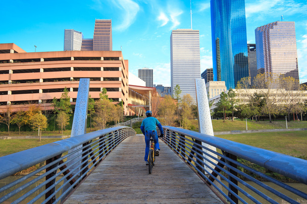 Biker on the street in Houston Texas Skyline with modern skyscra - Photo, Image