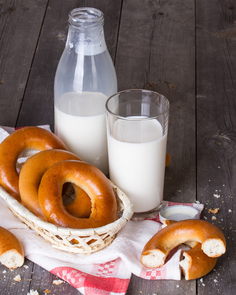 Milk and bagels on a wooden table - Foto, Imagen