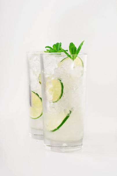Cocktails with rum in tall glass with ice, lime. mint - Fotografie, Obrázek