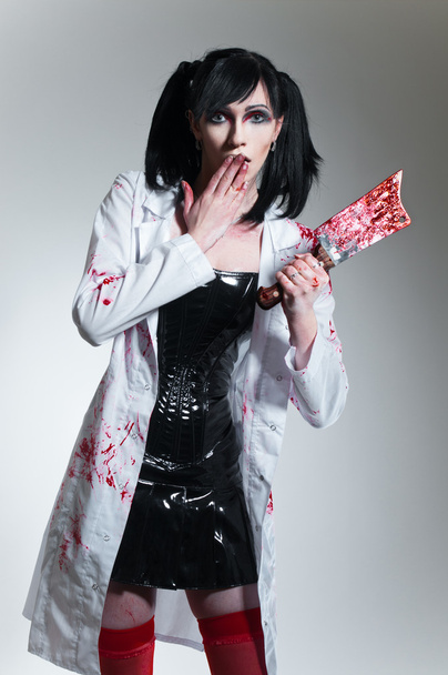 Crazy nurse with bloody knife - Foto, Imagen