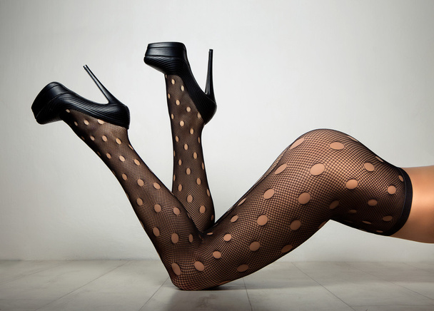 sexy long legs in black stockings - Фото, изображение