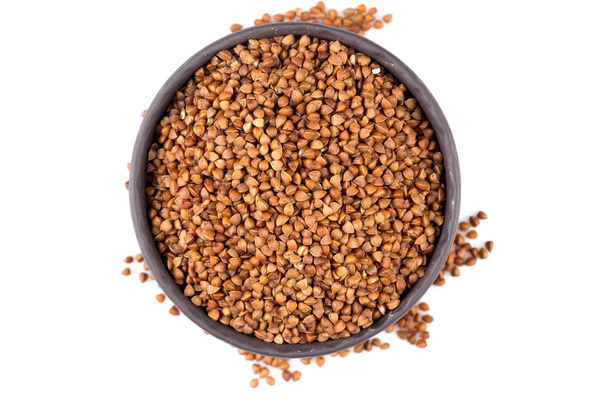 Buckwheat groats in a bowl - Fotó, kép