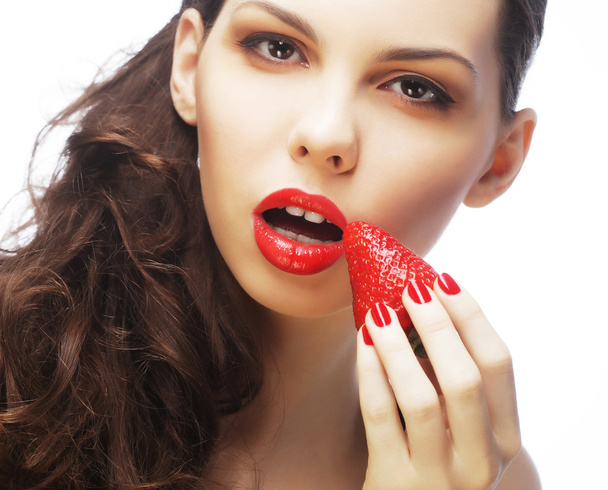 sexy lady holding a juicy strawberry - Photo, Image