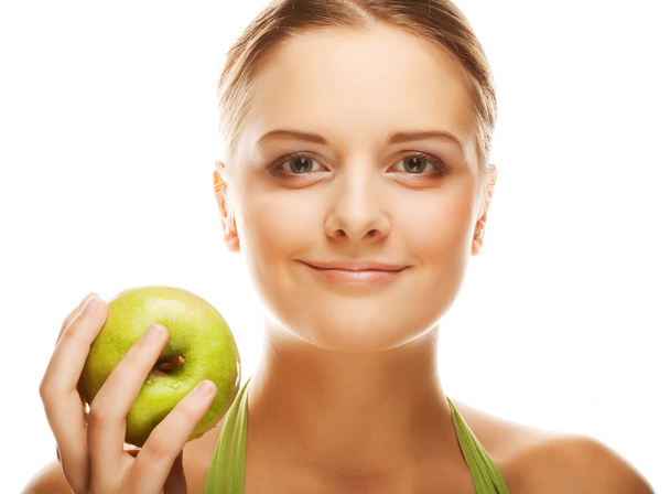 smiling woman with green apple. - Zdjęcie, obraz